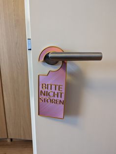 a door handle with a sticker on it that says bite night storen '