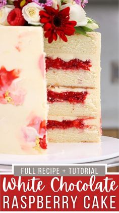 a white chocolate raspberry cake with flowers on top and text overlay that reads full recipe - tutorial white chocolate raspberry cake