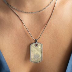 Our Shea Mother of Pearl Medical Dog Tag Necklace in Silver is simply stunning. Mother of pearl inlay set on a silver tone dog tag creates this statement piece. The silver tone medical caduceus symbol perfectly accents the pearl. This med ID necklace comes with an additional silver tone chain for a perfectly layered look. Each Shea Medic Alert Dog Tag Necklace features the internationally recognized medical caduceus symbol to alert medical personnel to your medical information that is custom eng Silver Dog Tag Jewelry With Charms, Silver Hypoallergenic Dog Tag Jewelry, Hypoallergenic Sterling Silver Dog Tag Jewelry, Hypoallergenic Silver Dog Tag Jewelry, Stainless Steel Dog Tag Jewelry For Memorial, Sterling Silver Dog Tag Jewelry For Keepsake, Medical Caduceus, Caduceus Symbol, Mother Of Pearl Inlay