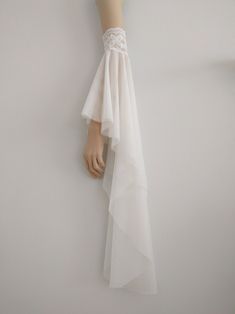 a mannequin's head wearing a white dress