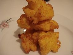 some fried food is on a white plate