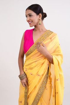 Yellow saree with woven floral blossom patterns and embellished border. Comes with contrast pink padded blouse.
Components: 2
Pattern: Embroidered
Type Of Work: Thread,Floral,Sequin
Neckline: V-neck
Sleeve Type: Sleeveless
Fabric: Cotton Silk, Raw Silk, Lining: Shantoon
Color: Yellow
Other Details: 
Attached lining
Model Height: 5ft 5inches, wearing size M
Length: Blouse: 15 inches
Weight: Approx 2 kgs
Closure: Blouse: Back zip
Occasion: Sangeet,Mehendi and Haldi - Aza Fashions Traditional V-neck Saree For Puja, Diwali V-neck Blouse With Mirror Work, Summer Designer Saree With Mirror Work, Designer Mirror Work Saree For Summer, Summer Saree With Mirror Work, Traditional Drape Saree With Mirror Work For Summer, Summer Festive Saree With Mirror Work, Traditional Summer Saree With Mirror Work, Traditional Saree With Mirror Work For Summer