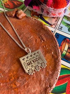 Beautiful necklace made of 925 silver by artisans from Guerrero, Mexico with a Papel Picado pendant, it is part of our Frida collection available only this month ✨This preorder may take 7 to 15 business days to ship, if you have any questions before ordering send us a message Measurements: 9.5" length / Papel Picado 1.5 cm CARE: -Do not apply perfume directly -Do not expose to cleaning chemicals -Store in jewelery box Bohemian Sterling Silver Pendant Charm Necklaces, Bohemian Sterling Silver Charm Necklace, Bohemian Sterling Silver Charm Necklace Nickel Free, Bohemian Sterling Silver Charm Necklaces In Silver, Bohemian Personalized Sterling Silver Charm Necklaces, Personalized Bohemian Sterling Silver Charm Necklace, Bohemian Sterling Silver Engraved Necklaces, Bohemian Sterling Silver Charm Necklaces For Gifts, Artisan Sterling Silver Necklaces For Gifts