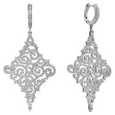 A delicate pair of drop earrings, intricately designed oozing instant Hollywood glamour. Featuring 8.00ct of round brilliant cut cubic zirconia, suspended from a lever back fastening, stunningly handcrafted in 925 sterling silver with a high gloss white rhodium finish. Dimensions 60mm drop by 30mm diameter. Also available with a 14kt rose gold finish. Drop Statement Earrings, English Art, Silver Lace, Rose Lace, Statement Drop Earrings, Hollywood Glamour, Round Brilliant, Gold Finish, High Gloss