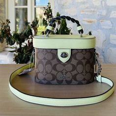 Guaranteed Authentic Brand New With Tags Attached Coach Signature Kay Crossbody Handbag Trunk Bag Sv/Khaki Pale Lime Nwt Womens 100% Authentic Brand: Coach Name: Signature Kay Crossbody Brd Color: Khaki Pale Lime Model: Cj613 Measurement: (W) 7.75" (H) 5.25" (D) 3.75" Handle Drop: 2.5" Strap Drop: 22.5" Adjustable/Detachable Pale Lime Smooth Leather And 2 Toned Khaki Medium "C" Coated Canvas Silver 'Coach Heritage Coach Emblem Closure: Lid W/ Turn Lock Hardware: Silvertone Stitching: Pale Lime/K Green Coach Satchel With Top Carry Handle, Green Rectangular Coated Canvas Bag, Green Coated Canvas Bag With Top Carry Handle, Green Coated Canvas Shoulder Bag For On-the-go, Green Coated Canvas On-the-go Shoulder Bag, Green Coated Canvas Shoulder Satchel, Luxury Olive Bag With Detachable Strap, Green Rectangular Coach Bags, Green Coach Tote Shoulder Bag