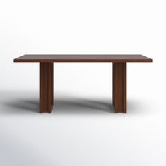 a wooden table on a white background with no one around it or the table is empty