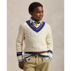 The cricket sweater is defined by its cable-knit pattern usually in cream as well as its V-neck and striped trim which traditionally represents school or club colors. This chunky-knit version is made with combed cotton yarns and washed for enhanced softness. Cricket Jumper, Preppy Lifestyle, Ralph Lauren Long Sleeve, Dolce E Gabbana, Mens Jumpers, Mens Sweatshirts Hoodie, Sleeves Pattern, Ralph Lauren Men, Jumpers And Cardigans