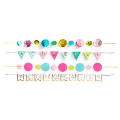 a party banner with the words happy birthday spelled in gold letters and confetti