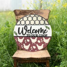 a welcome sign sitting on top of a wooden chair