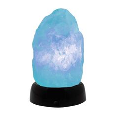 a blue himalayan salt lamp on a black stand