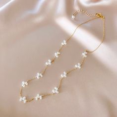 This delicate freshwater bead pearl necklace stands on it's own as a classic wardrobe staple and can be layered with any necklace.Handmade and attached to a delicate 14k gold-plated chain.Adjustable length "16-18". Pearl Layered Necklace With Pearl Charm For Gifts, Elegant Double Strand Beaded Necklaces With Adjustable Chain, Pearl Charm Layered Necklace Gift, Elegant Double Strand Beaded Necklace With Adjustable Chain, Gift Pearl Charm Layered Necklace, Double Strand Pearl Layered Necklace Gift, Double Strand Pearl Layered Necklace For Gift, Double Strand Pearl Layered Necklace As Gift, Gold Single Strand Feminine Necklace