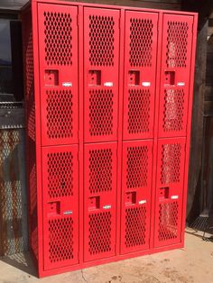 several red metal lockers sitting next to each other