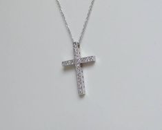 DIAMOND CROSS/ 14K GOLD DIAMOND CROSS/ GOLD DIAMOND CROSS/ VINTAGE DIAMOND CROSS/ RELIGIOUS GIFT / BIRTHDAY GIFT / CHRISTMAS GIFT/ WHITE GOLD DIAMOND CROSS / CONFIRMATION GIFT FREE SHIPPING WITHIN THE USA 14 KARAT SOLID WHITE GOLD AND DIAMOND CROSS NECKLACE. THE CHAIN IS ALSO 14K SOLID WHITE GOLD. I HAVE IT IN 14 INCHES THROUGH 18 INCHES. THE DIAMONDS ARE NATURAL ALL HAND PICKED AND SET 0.35 CTS SI1 CLARITY G COLOR. THE DESIGN IS AN OLD TECHNIQUE WE USE . THE DIAMONDS ARE FRAMED WITH A MILLGRAIN Gold Platinum Necklace Gift, Pave Setting Cross Necklace For Gift, Cross Necklace With Pave Setting For Gift, Cross Necklace With Pave Setting As Gift, Gold Platinum Necklace With Vvs Clarity, Silver Necklace With Pave Setting In 14k Gold, Gold Diamond Necklace In Platinum For Anniversary, Anniversary Cross Necklace With Pave Setting, Gold Platinum Diamond Necklace For Anniversary