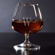 a wine glass with the letter w on it