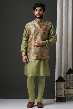 Sea green bundi with all-over floral print and stylized placket. Comes with kurta and pant.
Component: 3
Printed
Neckline: Band Collar
Sleeve Length: Kurta: Full; Nehru Jacket: Sleeveless
Fabric: Polyester Silk
Color: Green
Cuffed sleeves
Straight fit pant
Front button placket
Patch pockets
Note: Pocket square and brooch worn by the model is not for sale - Aza Fashions Collar Kurta, Kurta Set For Men, Straight Fit Pants, Luxury Sale, Nehru Jackets, Indian Wedding Outfits, Indian Fashion Designers, Pernia Pop Up Shop, Wedding Outfits