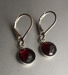 "Genuine Garnet Earrings Sterling Silver, Red Garnet Earrings Drop, January birthstone These garnet earrings will make a great gift! They made from: - Genuine faceted Mozambique red garnet 8mm cabochons set in sterling silver - Sterling silver lever back ear wires The earrings are about 1 \" long. Your order will be mailed within 2 business days nicely packaged and ready to be given. All US orders and most international orders will have tracking#. To see more of my jewelry: https://www.etsy.com/ Red Garnet Earrings, January Birthstone, Garnet Earrings, Earrings Drop, Gift For Wife, Earrings Sterling Silver, Red Garnet, Mozambique, Sterling Earrings