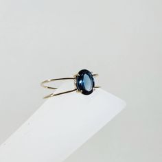 **KINDLY CHECK OUT THE VIDEO OF THE ITEM FOR A CLEARER VIEW**Details of the ring Gem: London Blue topaz Gem size: 8×6 mm Gem shape-Oval Gem weight: 1.45 carats Gold purity: 14KT (58.33% approx.) Gold weight: 1.03 Grams total weight of ring:1.32 Grams emerald cut london blue topaz gemstones set in solid 14KT yellow gold. The Gold purity is guaranteed and it comes with authentic 14 kt gold hallmark. Since these Rings are handmade, Size Customization is available for this ring and it is available i Modern Blue Sapphire Ring In 14k Gold, Modern 14k Gold Topaz Birthstone Ring, Modern 14k Gold Oval Topaz Ring, Modern Blue Topaz Ring In 14k Gold, Dainty Rings, Alternative Engagement Ring, Emerald Ring Gold, London Blue Topaz Ring, Black Onyx Ring