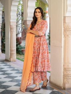 A poetic rendetion of a summer festive collection that makes you nostalgic, in classic luminous block prints. Handcrafted on a bed of fine cotton, mul and doria in hues of pastels. Perfect for light occasions. A set of 3 consists of kurta, pants & dupatta. Kurta: Summery florals combined with the most delicate silhouette inspired by the vintage bhopali peach kurta. This round neck, side gathered ghera kurta in cotton with loop button and gota detailing is a summer staple . Finished with hand pri