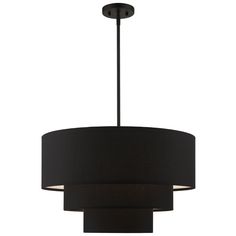 a black chandelier hanging from the ceiling with a round light fixture on it