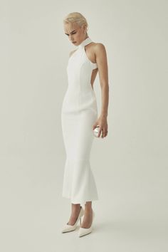 HALTER NECK MIDI DRESS, CRAFTED IN WHITE CREPE FABRIC, FEATURING AN OPEN BACK, AND A MERMAID SILHOUETTE. Halter Neck Midi Dress, Mermaid Silhouette, A Mermaid, Crepe Fabric, Halter Neck, Open Back, Beautiful Dresses, White And Black, Mermaid