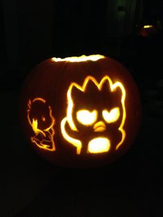 a pumpkin carved to look like an angry cat