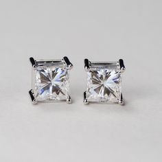 Our princess cut Charles & Colvard Forever One® colorless moissanite 4-prong stud earrings are a must have for every woman's jewelry box. Get the look and durability of diamonds, without the high cost and environmental footprint. Available in 14k, 18k yellow, white and rose gold as well as platinum. Choose desired metal and stone size from the drop-down menus before checkout. If you want these made with GIA certified diamonds, colored gemstones, or different moissanite shapes, please contact Square Cut Lab Grown Diamond Jewelry For Anniversary, Anniversary Jewelry With Square Cut Lab Grown Diamond, 14k White Gold Jewelry With Classic Cut, Fine Jewelry With Square Cut Lab Grown Diamond, Fine Jewelry Square Cut Lab Grown Diamond, Classic Diamond White Square Cut Earrings, Fine Jewelry With Moissanite In Classic Cut, Classic Square Cut Diamond White Earrings, Fine Jewelry With Classic Cut Moissanite