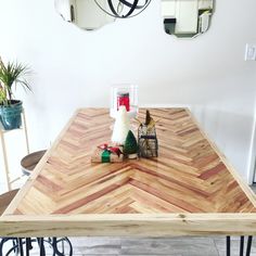 a wooden table sitting in the middle of a room