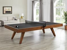 a ping pong table in the middle of a living room