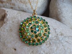 Green Necklace, Round Green Pendant, Green Jewelry, Green Crystal Rounded Pendant Necklace, Halo Gold Green Necklace This stunning halo green round pendant necklace have a great statement look that can't be missed. It would be great women necklace for evening dress or daily. Metal: 24K Gold Plated Gemstone: crystals Size: 3 cm long (1.18 inches). Chain: 45 cm long (about 18 inches) FOR MY NECKLACES COLLECTION HERE: https://www.etsy.com/il-en/shop/rebekajewelry?section_id=14211169&ref=shopsec Green Necklace With Large Medallion Pendant, Green Round Pendant Necklace For May Birthstone, Green May Birthstone Round Pendant Necklace, Green Round Large Pendant Jewelry, Gold Green Necklace, Small Heart Necklace, Climbing Earrings, Ear Crawler Earrings, Ear Parts