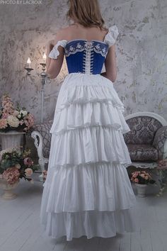 A beautiful Victorian petticoat is made from cotton and ruffled at the bottom edge and backside. Usually, it's worn under the bustle gown. In these pictures, a bustle cage is worn under the skirt. Please take attention that the bustle cage is not included in this price! But you can order it here: https://etsy.me/2TpD2E6 This underskirt will be perfect for Victorian and Edwardian events, parties, weddings, and theater productions. The closure skirt is constructed such that it can balance waist si Steampunk Wedding Dress, Victorian Bustle, Wedding Dress Bustle, Bustle Skirt, Under The Skirt, Classic Wedding Dress, Vintage Wardrobe, A Line Gown, Beautiful Skirts