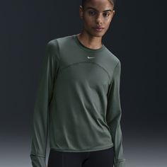 Whether it's a chill in the air or powerful rays, this easy-fitting crew-neck is ready to support you on your run. Sweat-wicking tech helps keep you comfortable and dry, and UV protection adds extra coverage so you can feel confident as you log your daily miles. Outdoor Athleisure Activewear Crew Neck, Sporty Crew Neck Outdoor Activewear, Nike Functional Crew Neck Top, Functional Nike Crew Neck Top, Technical Crew Neck Tops For Outdoor, Nike Technical Breathable Tops, Nike Functional Crew Neck Activewear, Midweight Casual Tops For Gym, Casual Midweight Tops For Gym