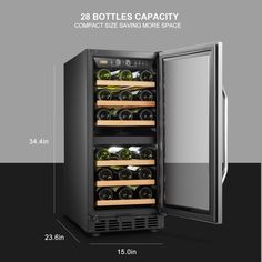 the wine cooler is open and has two bottles in it, with its door open