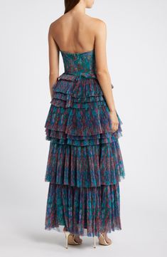 Bitty pleats span across the voluminous tiered skirt of this head-turning maxi dress that's adorned with passionate flowers. 58 1/2" regular length Strapless Lined 100% polyester Dry clean Imported Gala Maxi Dress With Ruffled Skirt, Multicolor Tiered Maxi Dress For Party, Tiered Pleated Maxi Dress For Party, Pleated Tiered Maxi Dress For Party, Spring Gala Tiered Maxi Dress, Blue Tiered Dress For Gala, Floor-length Dress With Ruffled Voluminous Skirt, Tiered Ruffled Skirt Maxi Dress For Cocktail, Tiered Ruffled Skirt Dress For Gala