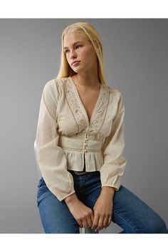 V-neckline with embroidery/Long sleeves/Peplum hem Casual Embroidered V-neck Top For Fall, Casual V-neck Top With Embroidered Sleeves, Casual V-neck Blouse With Embroidered Sleeves, Cotton V-neck Blouse With Embroidered Hem, Casual V-neck Blouse With Embroidered Hem, V-neck Tops With Embroidered Hem, Fall Cotton V-neck Embroidered Top, Beige Floral Embroidered V-neck Blouse, Embroidered V-neck Top For Fall