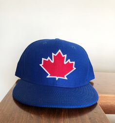 New Era Fifty Nine Fifty Toronto Blue Jays Fitted Hat size 7 1/2. This is a great looking hat that is different from the normal New Era's. It is unique, great color and awesome design. Adjustable Blue Flat Cap, Blue Adjustable Flat Cap, Baseball Season Snapback Fitted Hat, Blue Flat Cap For Baseball Season, Sports Event Fitted Hat With Flat Brim, Blue Fitted Hat With Flat Brim For Baseball Season, Blue Flat Brim Fitted Hat For Baseball Season, Blue Snapback Fitted Hat For Baseball Season, Blue Flat Cap For Sports