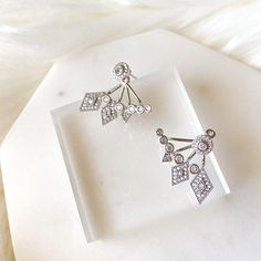 Our Fate and Chance Earrings are princess-worthy, bride-worthy quality earrings that feature sweeping line of geometric shapes in an ear jacket style. Using the highest grade AAA cubic zirconia, these gems will sparkle like no other! Ear Jacket Style: wear the stud alone for a simple, every day look OR together with the back part for a glamorous look Stud: 1/4 in Bottom /Back Piece: 1 inch wide Material: Copper, AAA cubic zirconia Lead, Nickel, Cadmium Free Earrings are FINAL SALE for hygienic r Back Piece, Ear Jacket, Back Pieces, Hypoallergenic Jewelry, Free Earrings, Jewelry Manufacturers, Jacket Style, Amazing Jewelry, Geometric Shapes