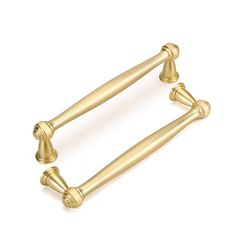 an image of two brass handles on a white background