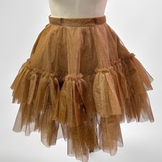 The Estelle mini ruffled skirt features an elastic waist band ,functional side pockets ,two layers of tulle fabric and ruffle designs. Perfect for minimalistic cute girl look! skirt/ruffled/cute outfit/short skirt/casual/party outfit Party Skort With Ruffles, Party Mini Skirt With Ruffles, Party Skort With Ruffle Hem And Tiered Skirt, Tiered Skirt Skort With Ruffle Hem For Parties, Party Skort With Ruffle Hem, Ruffle Hem Skort For Party, Flowy Tiered Skort For Party, Party Mini Flared Skirt With Ruffle Hem, Tiered Ruffle Mini Skirt For Party