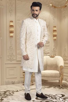 Introducing our U2-S345 sherwani, a sophisticated and exclusive piece for the modern man. This open jacket sherwani exudes elegance with a touch of luxury, perfect for any formal occasion. Elevate your style with our finely-crafted sherwani, designed to make a statement with its timeless design and impeccable fit. Men Sherwani Wedding Pakistani, Luxury Bandhgala For Groom, Elegant Off White Sherwani With Resham Embroidery, Elegant Cream Sherwani With Intricate Embroidery, Classic Sherwani For Wedding And Festive Occasions, Elegant Cream Sherwani With Zari Work, Classic Wedding Sherwani For Festive Occasions, Classic Wedding Sherwani For Festive Season, Elegant White Formal Kurta