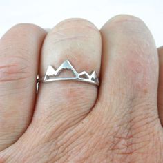 A sweet and delicate sterling silver Mountaintop Ring in Sterling Silver. This ring can be worn alone or stack it with other rings. It is made of Sterling Silver (.925). I offer it in a variety of sizes. This listing is for one (1) ring. Your ring will ship in a gift box. Silver Sterling Stackable Rings With Simple Design, Silver Stackable Rings With Simple Design In Sterling Silver, Simple Adjustable Sterling Silver Stackable Rings, Unique Sterling Silver Midi Rings For Weddings, Simple Adjustable Sterling Silver Ring, Sterling Silver Midi Promise Ring With Simple Design, Simple Silver Stackable Rings For Wedding, Simple Design Silver Sterling Stackable Rings, Sterling Silver Simple Design Midi Promise Ring