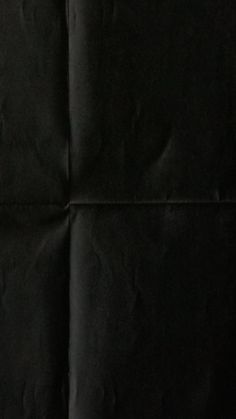 a piece of black paper that has been folded