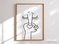 a black and white drawing of a person's hand holding up a toothbrush