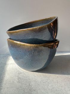 two bowls sitting side by side on a table