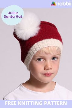 a young boy wearing a red and white knitted hat