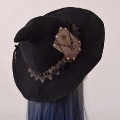 Celebrate Halloween with our Steampunk Witch hat! Are you ready to take your Halloween costume to the next level? Our Steampunk Witch Hat is the perfect accessory to complete your enchanting steampunk-themed look. This hat is designed with the utmost attention to detail, making it a must-have for any cosplay enthusiast. Crafted with a blend of mystical elegance and steampunk charm, this witch hat boasts intricate designs that are sure to captivate attention. The classic black color, coupled with Witchy Attire, Steampunk Witch, Hat Cosplay, Steampunk Items, Steampunk Crafts, Wizard Hat, Gothic Witch, Cosplay Accessories, Head Wear