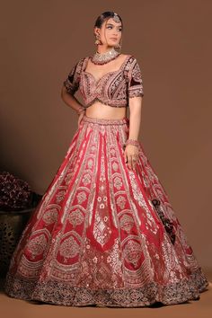 Crimson red flared banarasi silk kalidar lehenga with Mughal garden embroidery using zari thread, sequin and beads highlights. Paired with a heavily zari, sequin embroidered flattering sweetheart neck velvet maroon blouse and a floral embroidered cutwork border tissue organza dupatta. - Aza Fashions Red Gown With Cutdana For Wedding, Red Wedding Gown With Cutdana Details, Red Wedding Gown With Cutdana, Red Semi-stitched Kundan Gown, Red Anarkali Fitted Lehenga, Anarkali Style Fitted Red Lehenga, Fitted Red Anarkali Lehenga, Festive Red Kundan Gown, Red Kundan Wedding Sets