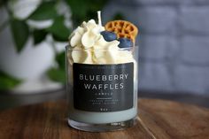 a blueberry waffles candle is sitting on a table