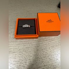 Gently Used Authentic Hermes Silver Ring. Comes With Original Box. Luxury Silver Jewelry With Original Box, Designer Silver Jewelry With Original Box, Designer Silver Jewelry In Original Box, Timeless Jewelry In Original Box For Gift, Timeless Jewelry In Original Box As Gift, Silver Jewelry In Original Box For Anniversary, Designer Platinum Jewelry Gift, Designer Platinum Jewelry For Gift, Platinum Ring Gift