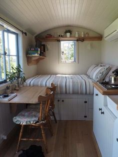 a small room with a bed, desk and window in the corner is featured on instagram