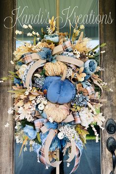 the front door is decorated with blue and tan flowers